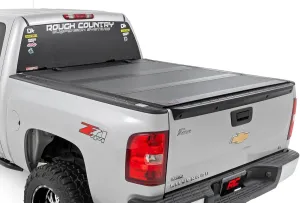 Rough Country Hard Tri-Fold Flip Up Truck Bed Tonneau Cover for Chevy Silverado and GMC Sierra 1500 (2007-2013) - Fits 5'9 (69.3") Bed with Rail Caps Rough Country Hard Tri-Fold Flip Up Truck Bed Tonneau Cover for Chevy Silverado and GMC Sierra 1500 (2007-2013) - Fits 5'9 (69.3") Bed with Rail Caps